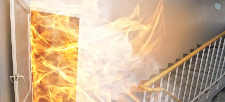 Fire breaching a doorway into a stairwell